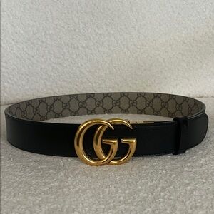 Gucci reversible Black and brown monogram belt with Gold GG Buckle